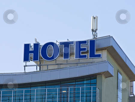 To use this stock image in your creative project, please select the size you need over to the right and click the "Add to Cart" button.
Your downloaded image will come with the Cutcaster watermark removed so don’t worry about the watermark you see on this page. Hotel stock photo, Hotel signs at the building against the blue sky by Sergej Razvodovskij