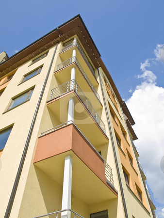 To use this stock image in your creative project, please select the size you need over to the right and click the "Add to Cart" button.
Your downloaded image will come with the Cutcaster watermark removed so don’t worry about the watermark you see on this page. Flat building stock photo, Flat building against the blue sky with clouds by Sergej Razvodovskij