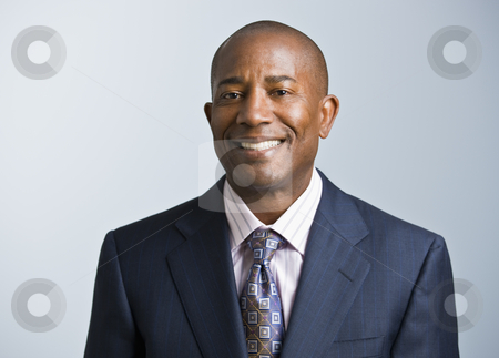 To use this stock image in your creative project, please select the size you need over to the right and click the "Add to Cart" button.
Your downloaded image will come with the Cutcaster watermark removed so don’t worry about the watermark you see on this page. African American male stock photo, Attractive African American headshot dressed in a suit and tie, facing the camera. Square. by Jonathan Ross