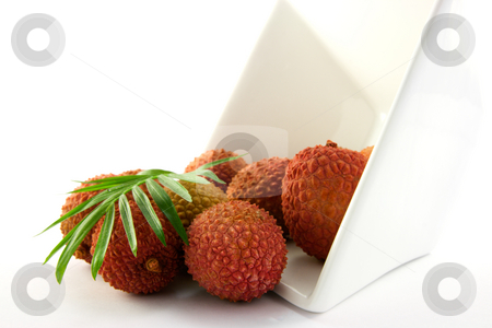 To use this stock image in your creative project, please select the size you need over to the right and click the "Add to Cart" button.
Your downloaded image will come with the Cutcaster watermark removed so don’t worry about the watermark you see on this page. Lychee Spilling out of a Dish with Leaf stock photo, Lychee and green leaf spilling out a dish with clipping on a white background by Keith Wilson