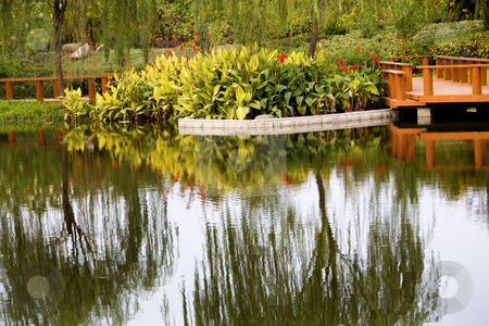 To use this stock image in your creative project, please select the size you need over to the right and click the "Add to Cart" button.
Your downloaded image will come with the Cutcaster watermark removed so don’t worry about the watermark you see on this page. Weilaiyu Shanghai Suburbs Garden Red Flowers Willows Water Refle stock photo, Weilaiyu Shanghai Suburbs Garden Water Reflections Red Flowers Willows Wooden Pier Summer by William Perry