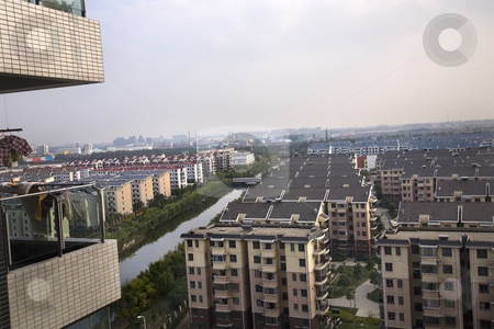 To use this stock image in your creative project, please select the size you need over to the right and click the "Add to Cart" button.
Your downloaded image will come with the Cutcaster watermark removed so don’t worry about the watermark you see on this page. Shanghai Suburbs stock photo, Shanghai Suburbs Residential Area apartments river, living area With Trademarks. by William Perry