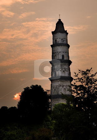 To use this stock image in your creative project, please select the size you need over to the right and click the "Add to Cart" button.
Your downloaded image will come with the Cutcaster watermark removed so don’t worry about the watermark you see on this page. Great Mercy Pagoda, Shaoxing, China stock photo, Great Mercy Pagoda, Shaoxing, Zhejiang Province, China, Sunrise in orange pink sky. Ancient Pagoda built 1,000 years ago, by William Perry