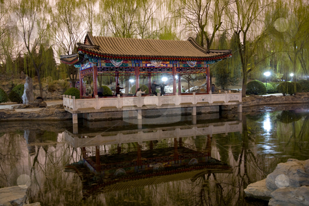 To use this stock image in your creative project, please select the size you need over to the right and click the "Add to Cart" button.
Your downloaded image will come with the Cutcaster watermark removed so don’t worry about the watermark you see on this page. Wushu in Park, Practicing Tai Chi, Temple of Sun pavilion stock photo, Wushu in Park, Practicing Tai Chi, Temple of Sun Pavilion, Pond, Reflection, Willows, Beijing, China by William Perry