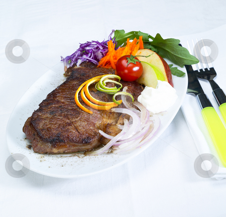 To use this stock image in your creative project, please select the size you need over to the right and click the "Add to Cart" button.
Your downloaded image will come with the Cutcaster watermark removed so don’t worry about the watermark you see on this page. Beef ribeye steak stock photo, Fresh juicy beef ribeye steak grilled with lemon and orange peel on top and vegetables beside with sour cream by Francesco Perre