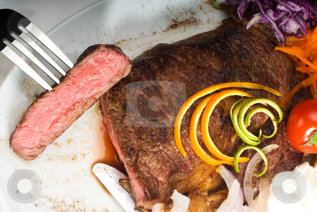 To use this stock image in your creative project, please select the size you need over to the right and click the "Add to Cart" button.
Your downloaded image will come with the Cutcaster watermark removed so don’t worry about the watermark you see on this page. Beef ribeye steak stock photo, Fresh juicy beef ribeye steak sliced ,with lemon and orange peel on top and vegetable beside by Francesco Perre