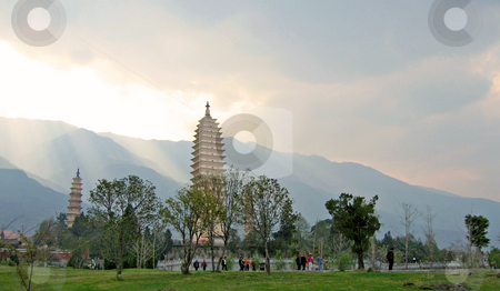 To use this stock image in your creative project, please select the size you need over to the right and click the "Add to Cart" button.
Your downloaded image will come with the Cutcaster watermark removed so don’t worry about the watermark you see on this page. Towering buddhist temples in the afternoon light in dali, china stock photo, by Shi Liu