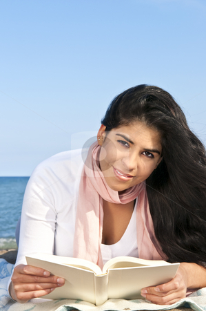 To use this stock image in your creative project, please select the size you need over to the right and click the "Add to Cart" button.
Your downloaded image will come with the Cutcaster watermark removed so don’t worry about the watermark you see on this page. Young native american woman reading stock photo, Portrait of beautiful smiling native american girl reading book at beach by Elena Elisseeva