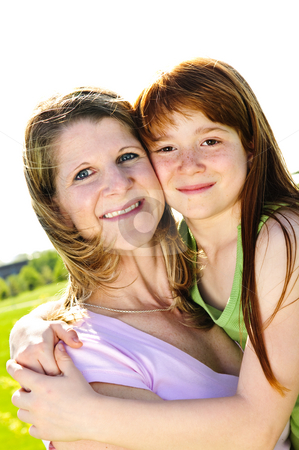 To use this stock image in your creative project, please select the size you need over to the right and click the "Add to Cart" button.
Your downloaded image will come with the Cutcaster watermark removed so don’t worry about the watermark you see on this page. Mother and daughter hugging stock photo, Portrait of happy child hugging her mother by Elena Elisseeva