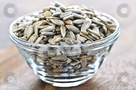 To use this stock image in your creative project, please select the size you need over to the right and click the "Add to Cart" button.
Your downloaded image will come with the Cutcaster watermark removed so don’t worry about the watermark you see on this page. Sunflower seeds stock photo, Shelled sunflower seeds close up in glass bowl by Elena Elisseeva