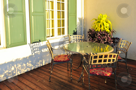 To use this stock image in your creative project, please select the size you need over to the right and click the "Add to Cart" button.
Your downloaded image will come with the Cutcaster watermark removed so don’t worry about the watermark you see on this page. Patio furniture stock photo, Patio chairs and tables on wooden patio deck by Elena Elisseeva