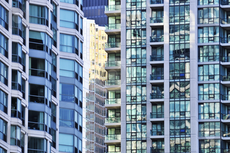 To use this stock image in your creative project, please select the size you need over to the right and click the "Add to Cart" button.
Your downloaded image will come with the Cutcaster watermark removed so don’t worry about the watermark you see on this page. Apartment buildings stock photo, Tall condominium or apartment buildings in the city by Elena Elisseeva