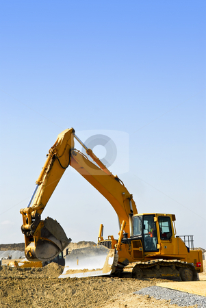To use this stock image in your creative project, please select the size you need over to the right and click the "Add to Cart" button.
Your downloaded image will come with the Cutcaster watermark removed so don’t worry about the watermark you see on this page. Construction site machines stock photo, Yellow bulldozer machines digging and moving earth at construction site by Elena Elisseeva