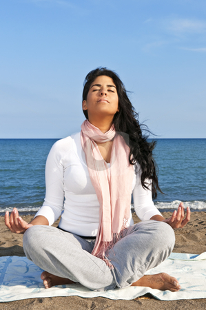 To use this stock image in your creative project, please select the size you need over to the right and click the "Add to Cart" button.
Your downloaded image will come with the Cutcaster watermark removed so don’t worry about the watermark you see on this page. Young native american woman meditating stock photo, Portrait of beautiful native american girl doing yoga at beach by Elena Elisseeva