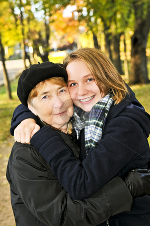 To use this stock image in your creative project, please select the size you need over to the right and click the "Add to Cart" button.
Your downloaded image will come with the Cutcaster watermark removed so don’t worry about the watermark you see on this page. Granddaughter hugging grandmother stock photo, Teen granddaughter hugging grandmother in autumn park by Elena Elisseeva