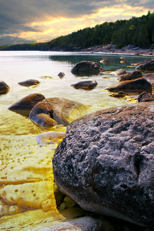 To use this stock image in your creative project, please select the size you need over to the right and click the "Add to Cart" button.
Your downloaded image will come with the Cutcaster watermark removed so don’t worry about the watermark you see on this page. Rocks at shore of Georgian Bay stock photo, Rocks in clear golden water of Georgian Bay at Bruce peninsula Ontario Canada by Elena Elisseeva