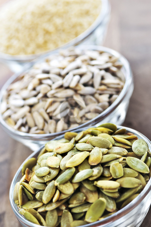 To use this stock image in your creative project, please select the size you need over to the right and click the "Add to Cart" button.
Your downloaded image will come with the Cutcaster watermark removed so don’t worry about the watermark you see on this page. Pumpkin sunflower and sesame seeds stock photo, Pumpkin sunflower and sesame seeds close up in glass bowl by Elena Elisseeva