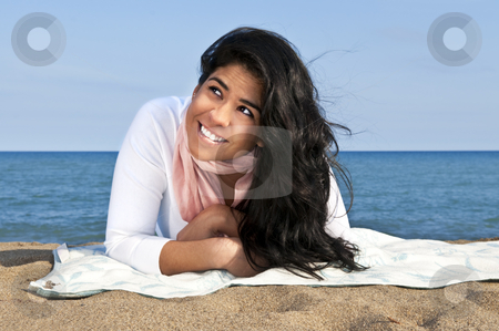 To use this stock image in your creative project, please select the size you need over to the right and click the "Add to Cart" button.
Your downloaded image will come with the Cutcaster watermark removed so don’t worry about the watermark you see on this page. Young native american woman at beach stock photo, Portrait of beautiful smiling native american girl laying at beach looking up by Elena Elisseeva