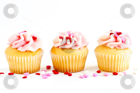 To use this stock image in your creative project, please select the size you need over to the right and click the "Add to Cart" button.
Your downloaded image will come with the Cutcaster watermark removed so don’t worry about the watermark you see on this page. Cupcakes stock photo, Row of tasty cupcakes with icing and sprinkles by Elena Elisseeva