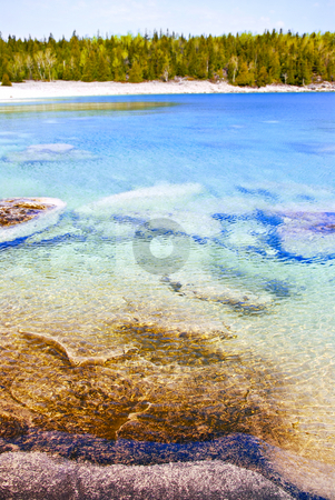 To use this stock image in your creative project, please select the size you need over to the right and click the "Add to Cart" button.
Your downloaded image will come with the Cutcaster watermark removed so don’t worry about the watermark you see on this page. Clear water at shore of Georgian Bay stock photo, Clear waters of Georgian Bay at Bruce peninsula Ontario Canada by Elena Elisseeva