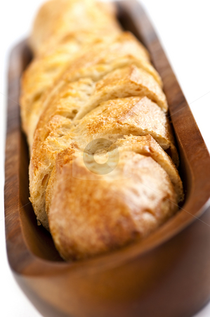 To use this stock image in your creative project, please select the size you need over to the right and click the "Add to Cart" button.
Your downloaded image will come with the Cutcaster watermark removed so don’t worry about the watermark you see on this page. Baguette stock photo, Isolated sliced baguette bread in wooden dish by Elena Elisseeva
