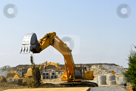 To use this stock image in your creative project, please select the size you need over to the right and click the "Add to Cart" button.
Your downloaded image will come with the Cutcaster watermark removed so don’t worry about the watermark you see on this page. Construction site machines stock photo, Yellow bulldozer machines digging and moving earth at construction site by Elena Elisseeva