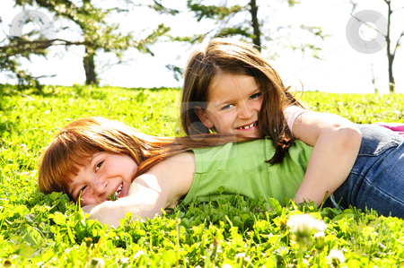 To use this stock image in your creative project, please select the size you need over to the right and click the "Add to Cart" button.
Your downloaded image will come with the Cutcaster watermark removed so don’t worry about the watermark you see on this page. Young sisters stock photo, Portrait of happy girls playing on grass by Elena Elisseeva