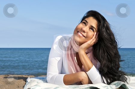 To use this stock image in your creative project, please select the size you need over to the right and click the "Add to Cart" button.
Your downloaded image will come with the Cutcaster watermark removed so don’t worry about the watermark you see on this page. Young native american woman at beach stock photo, Portrait of beautiful smiling native american girl laying at beach by Elena Elisseeva