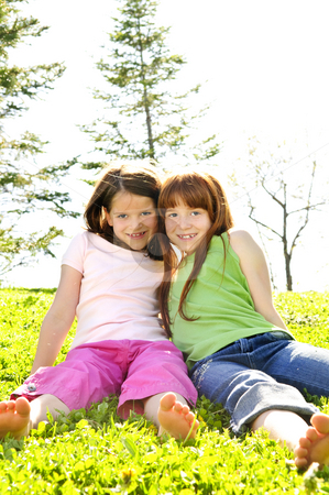 To use this stock image in your creative project, please select the size you need over to the right and click the "Add to Cart" button.
Your downloaded image will come with the Cutcaster watermark removed so don’t worry about the watermark you see on this page. Young sisters stock photo, Portrait of happy girls sitting on grass by Elena Elisseeva