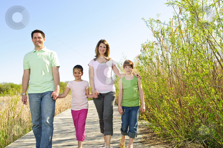 To use this stock image in your creative project, please select the size you need over to the right and click the "Add to Cart" button.
Your downloaded image will come with the Cutcaster watermark removed so don’t worry about the watermark you see on this page. Happy family stock photo, Portrait of happy family of four walking on boardwalk by Elena Elisseeva