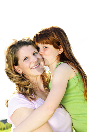 To use this stock image in your creative project, please select the size you need over to the right and click the "Add to Cart" button.
Your downloaded image will come with the Cutcaster watermark removed so don’t worry about the watermark you see on this page. Mother and daughter hugging stock photo, Portrait of happy child hugging and kissing her mother by Elena Elisseeva