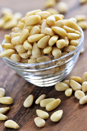 To use this stock image in your creative project, please select the size you need over to the right and click the "Add to Cart" button.
Your downloaded image will come with the Cutcaster watermark removed so don’t worry about the watermark you see on this page. Bowl of pine nuts stock photo, Glass bowl with big pile of pine nuts by Elena Elisseeva