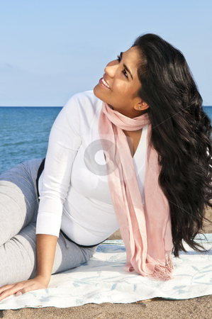 To use this stock image in your creative project, please select the size you need over to the right and click the "Add to Cart" button.
Your downloaded image will come with the Cutcaster watermark removed so don’t worry about the watermark you see on this page. Young native american woman at beach stock photo, Portrait of beautiful smiling native american girl sitting at beach by Elena Elisseeva