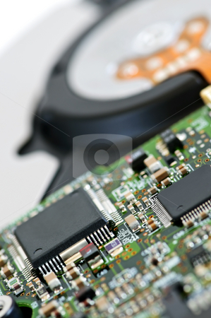To use this stock image in your creative project, please select the size you need over to the right and click the "Add to Cart" button.
Your downloaded image will come with the Cutcaster watermark removed so don’t worry about the watermark you see on this page. Hard drive detail stock photo, Closeup of hard disk drive internal electronics by Elena Elisseeva