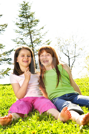 To use this stock image in your creative project, please select the size you need over to the right and click the "Add to Cart" button.
Your downloaded image will come with the Cutcaster watermark removed so don’t worry about the watermark you see on this page. Young sisters stock photo, Portrait of happy girls sitting on grass by Elena Elisseeva