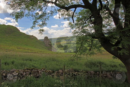 To use this stock image in your creative project, please select the size you need over to the right and click the "Add to Cart" button.
Your downloaded image will come with the Cutcaster watermark removed so don’t worry about the watermark you see on this page. Dry stone wall in Derbyshire England stock photo, In the hills of England dry stone walls are made to divide fields as no hedges will grow in the shallow soil. by Ian Langley