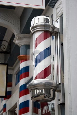 To use this stock image in your creative project, please select the size you need over to the right and click the "Add to Cart" button.
Your downloaded image will come with the Cutcaster watermark removed so don’t worry about the watermark you see on this page. Barber Shop Pole stock photo, An old antique barber shop pole with red and blue stripes. by Todd Arena