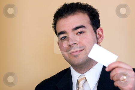 To use this stock image in your creative project, please select the size you need over to the right and click the "Add to Cart" button.
Your downloaded image will come with the Cutcaster watermark removed so don’t worry about the watermark you see on this page. Handing a Business Card stock photo, Close up of a man holding a business card up. Plenty of copyspace for your logo or design. Shallow depth of field. by Todd Arena