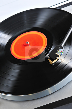 To use this stock image in your creative project, please select the size you need over to the right and click the "Add to Cart" button.
Your downloaded image will come with the Cutcaster watermark removed so don’t worry about the watermark you see on this page. Record on turntable stock photo, Vinyl record spinning on turntable close up by Elena Elisseeva