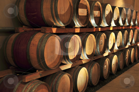 To use this stock image in your creative project, please select the size you need over to the right and click the "Add to Cart" button.
Your downloaded image will come with the Cutcaster watermark removed so don’t worry about the watermark you see on this page. Wine barrels stock photo, Stacked oak wine barrels in winery cellar by Elena Elisseeva