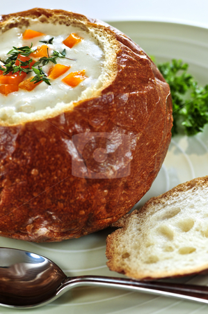 To use this stock image in your creative project, please select the size you need over to the right and click the "Add to Cart" button.
Your downloaded image will come with the Cutcaster watermark removed so don’t worry about the watermark you see on this page. Soup in bread bowl stock photo, Lunch of soup served in baked round bread bowl by Elena Elisseeva