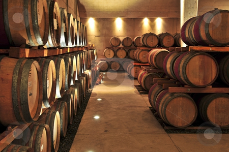 To use this stock image in your creative project, please select the size you need over to the right and click the "Add to Cart" button.
Your downloaded image will come with the Cutcaster watermark removed so don’t worry about the watermark you see on this page. Wine barrels stock photo, Stacked oak wine barrels in winery cellar by Elena Elisseeva