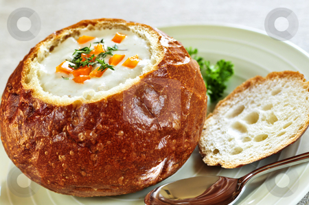 To use this stock image in your creative project, please select the size you need over to the right and click the "Add to Cart" button.
Your downloaded image will come with the Cutcaster watermark removed so don’t worry about the watermark you see on this page. Soup in bread bowl stock photo, Lunch of soup served in baked round bread bowl by Elena Elisseeva