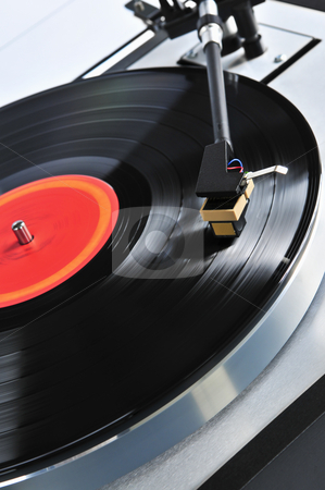To use this stock image in your creative project, please select the size you need over to the right and click the "Add to Cart" button.
Your downloaded image will come with the Cutcaster watermark removed so don’t worry about the watermark you see on this page. Record on turntable stock photo, Vinyl record spinning on turntable close up by Elena Elisseeva