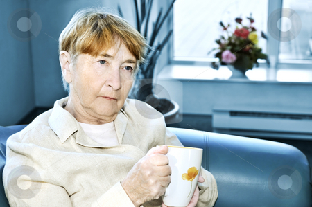 To use this stock image in your creative project, please select the size you need over to the right and click the "Add to Cart" button.
Your downloaded image will come with the Cutcaster watermark removed so don’t worry about the watermark you see on this page. Sad elderly woman stock photo, Sad elderly woman sitting with cup of tea by Elena Elisseeva