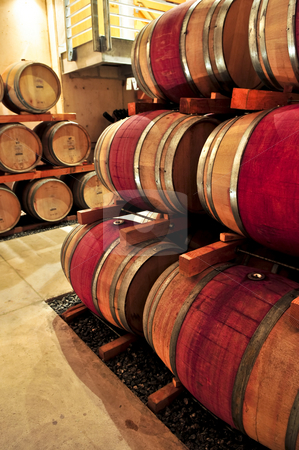 To use this stock image in your creative project, please select the size you need over to the right and click the "Add to Cart" button.
Your downloaded image will come with the Cutcaster watermark removed so don’t worry about the watermark you see on this page. Wine barrels stock photo, Stacked oak wine barrels in winery cellar by Elena Elisseeva