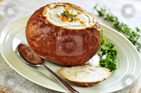 To use this stock image in your creative project, please select the size you need over to the right and click the "Add to Cart" button.
Your downloaded image will come with the Cutcaster watermark removed so don’t worry about the watermark you see on this page. Soup in bread bowl stock photo, Lunch of soup served in baked round bread bowl by Elena Elisseeva
