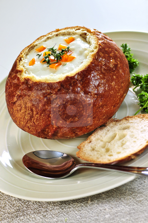To use this stock image in your creative project, please select the size you need over to the right and click the "Add to Cart" button.
Your downloaded image will come with the Cutcaster watermark removed so don’t worry about the watermark you see on this page. Soup in bread bowl stock photo, Lunch of soup served in baked round bread bowl by Elena Elisseeva