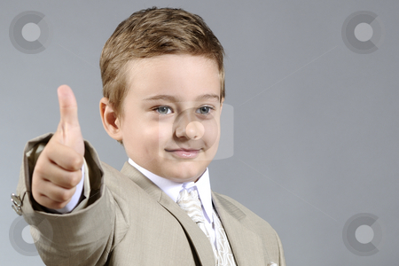 To use this stock image in your creative project, please select the size you need over to the right and click the "Add to Cart" button.
Your downloaded image will come with the Cutcaster watermark removed so don’t worry about the watermark you see on this page. Ok boy stock photo, Little boy showing his ok attitude by Dragos Iliescu