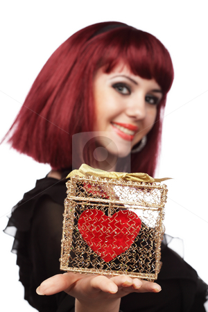 To use this stock image in your creative project, please select the size you need over to the right and click the "Add to Cart" button.
Your downloaded image will come with the Cutcaster watermark removed so don’t worry about the watermark you see on this page. Happy girl smiling with heart packed in a golden gift box stock photo, Happy woman smiling with heart packed in a golden gift box in her hand.Shallow DOF,focus on the heart. by Ivelin Radkov